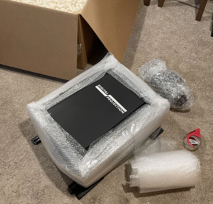 Digital Projection projector package being prepared for resale